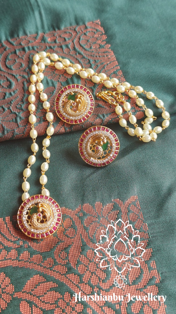 Peacock pendant set with pearl chain