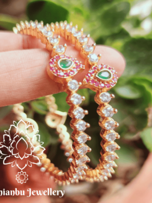 Solitaire white stone bangles with mango motifs