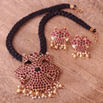 Gandaberunda pendant set with knotted black rope