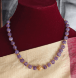 Purple beads with antique ball