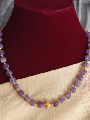 Purple beads with antique ball