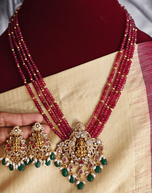 Lakshmi pendant set with four line Maroon beads with antique gold balls