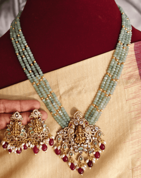 Lakshmi pendant set with four line light green beads with antique balls