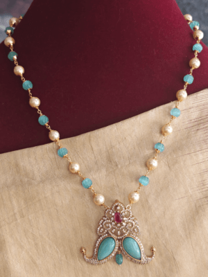 Fusion claw pendant with turquoise pumpkin beads mala