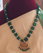 Navratna pendant with green flat beads mixed with pearls