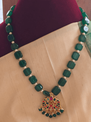 Navratna pendant with green flat beads mixed with pearls