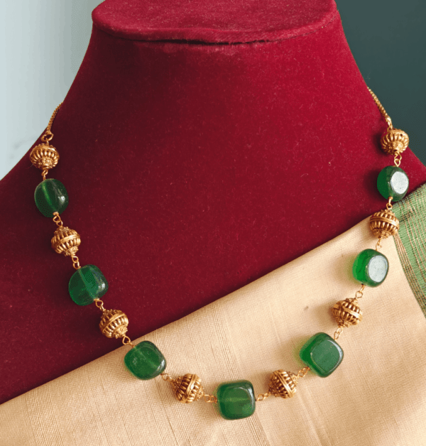 Green flat beads chain with antique balls