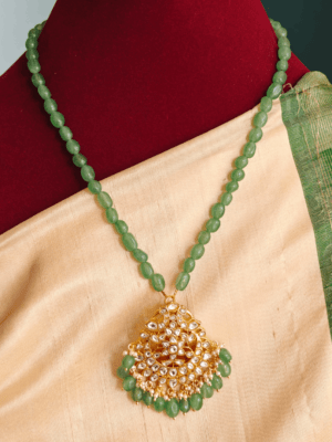 Mossainaite white stone pendant with green beads