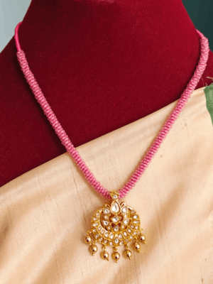 White amirtham kundan pendant with pink hydrocrystal beads