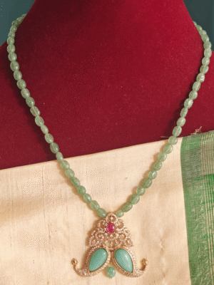 Turquoise fusion claw pendant with light green beads