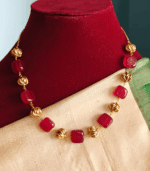 Red flat beads with antique balls