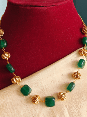 Green flat beads with antique balls