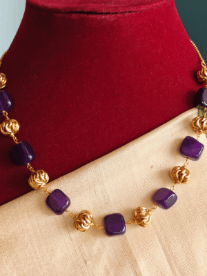 Purple flat beads with antique balls