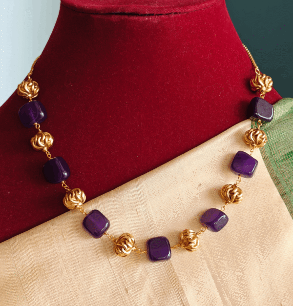 Purple flat beads with antique balls