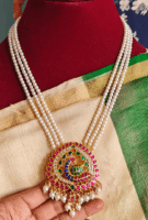 Peacock jadau pendant with three line pearl chain