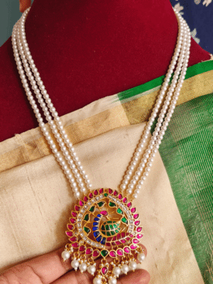 Peacock jadau pendant with three line pearl chain