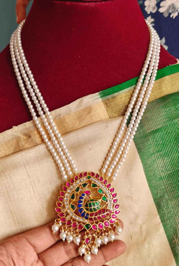 Peacock jadau pendant with three line pearl chain