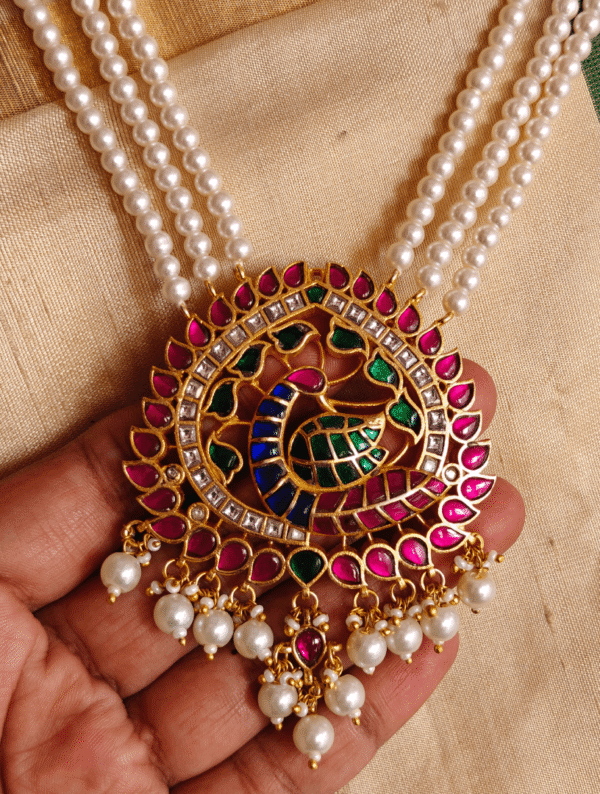 Peacock jadau pendant with three line pearl chain