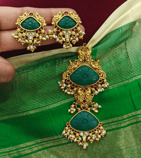 Double carved stone pendant