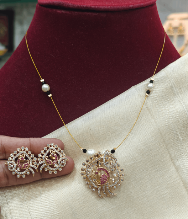 Amrutha peacock invisible set (Ruby white)