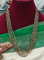 Four line thulasi beads antique long mala (green)