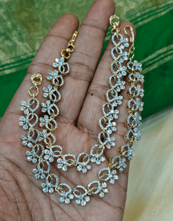 Flower tilak american diamond ear chain