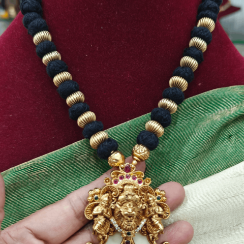 Narasimha claw pendant with black and gold balls