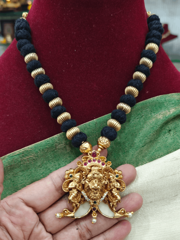 Narasimha claw pendant with black and gold balls
