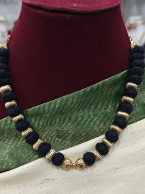 Black rope with antique gold balls