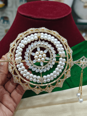 Pearl with rose gold polish hair bun cage