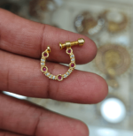 White and ruby screw nose ring