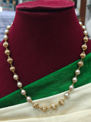 Pearl mala with gold balls
