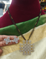 Kolam pendant with the black beads