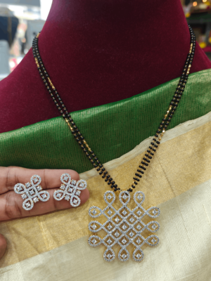 Kolam pendant with the black beads