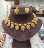 Mango with gold ball`s choker