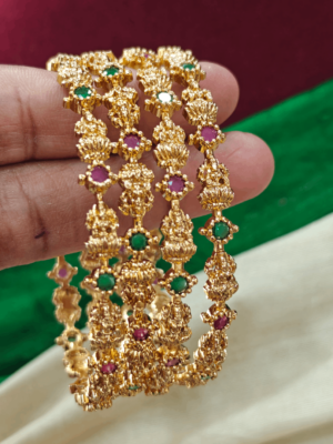 Lakshmi with green and ruby stone bangles