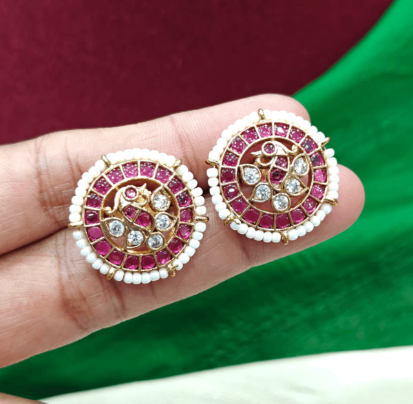 Pearl ruby peacock stud